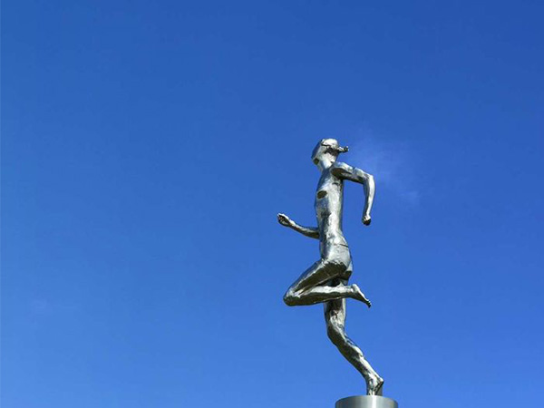 metal steel running person landscape sculpture