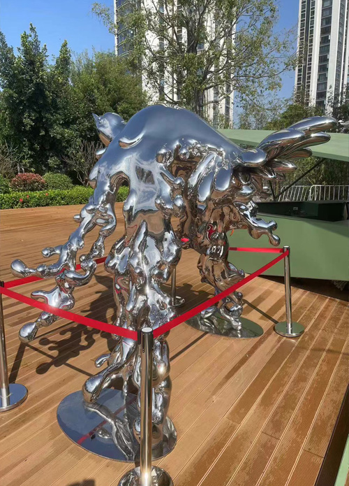 Stainless steel sea water and flying bird sculptures