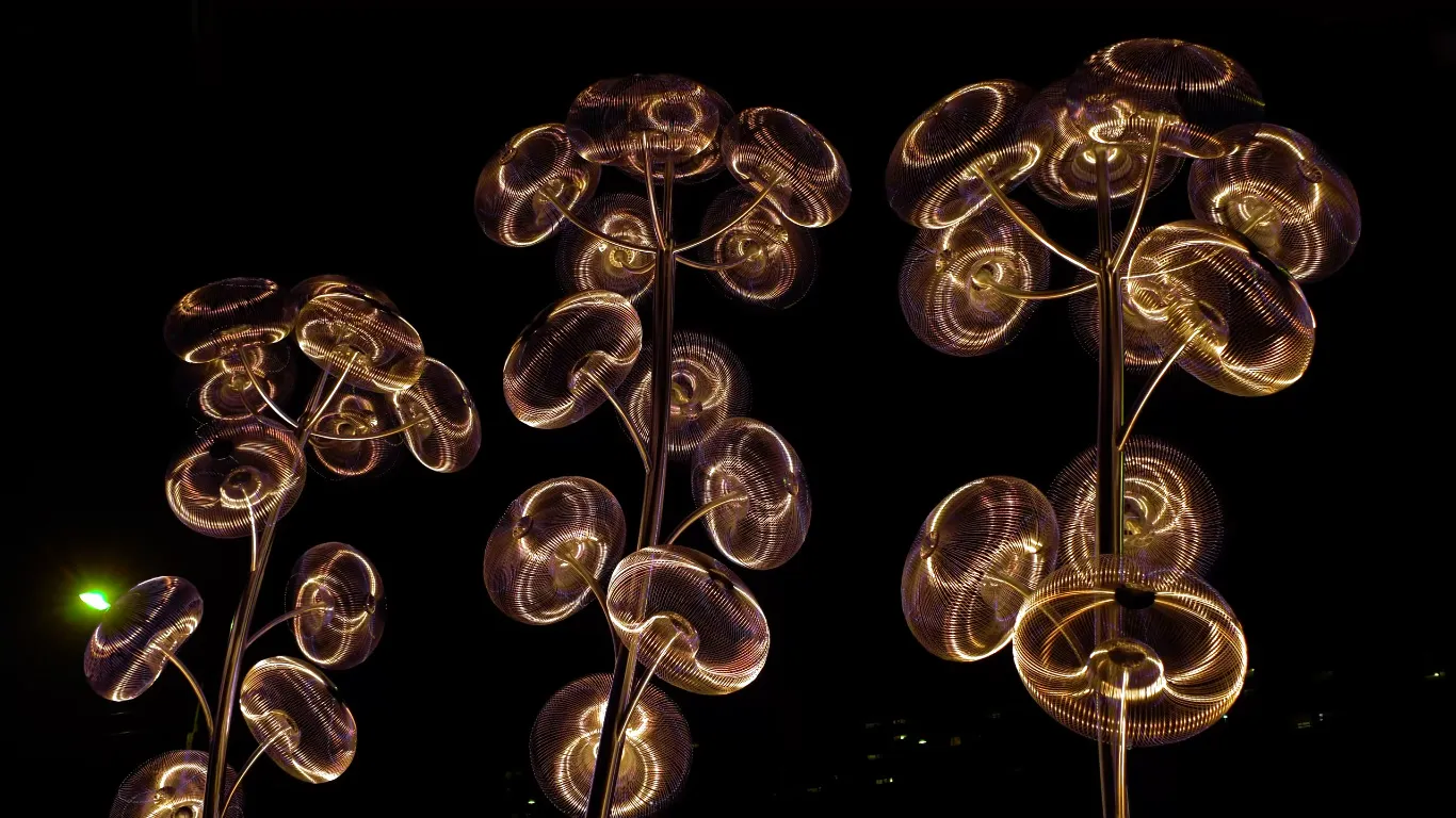 Landscape bubble tree abstract sculpture with yellow lighting at night