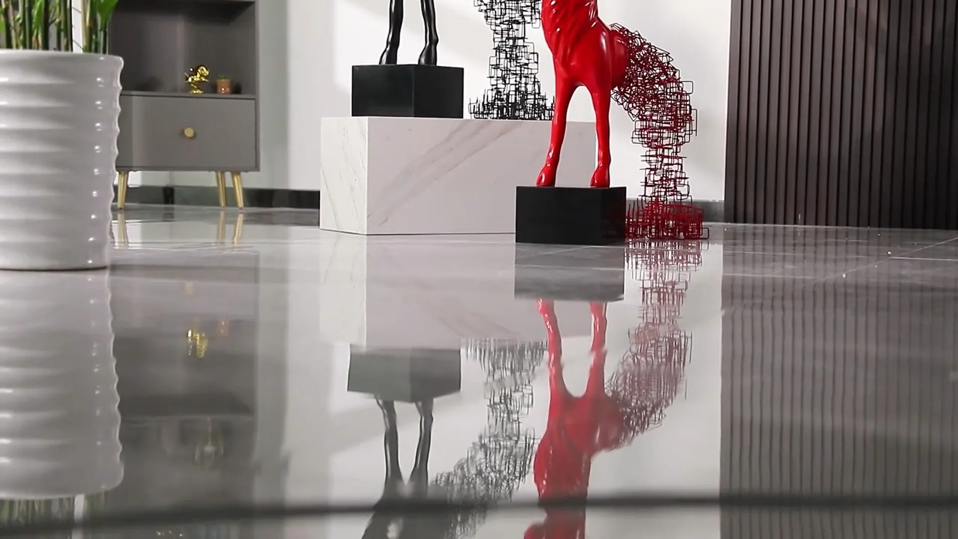 Reflection of the elk sculpture on smooth marble floor