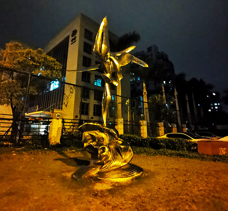 night view of abstract seagull sculpture