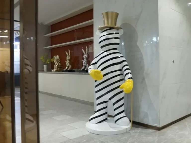 Striped white cartoon bear sculpture in hotel lobby